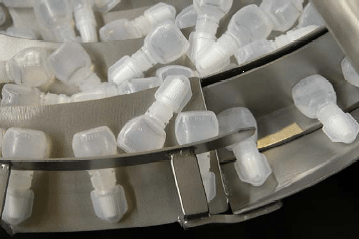 Orientating and Feeding of Xalatan Bottles