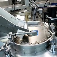 Centrifugal Feeder orientates and feeds a range of Coin Blanks