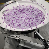 Vibratory Bowl Feeder Feeds Test Tubes
