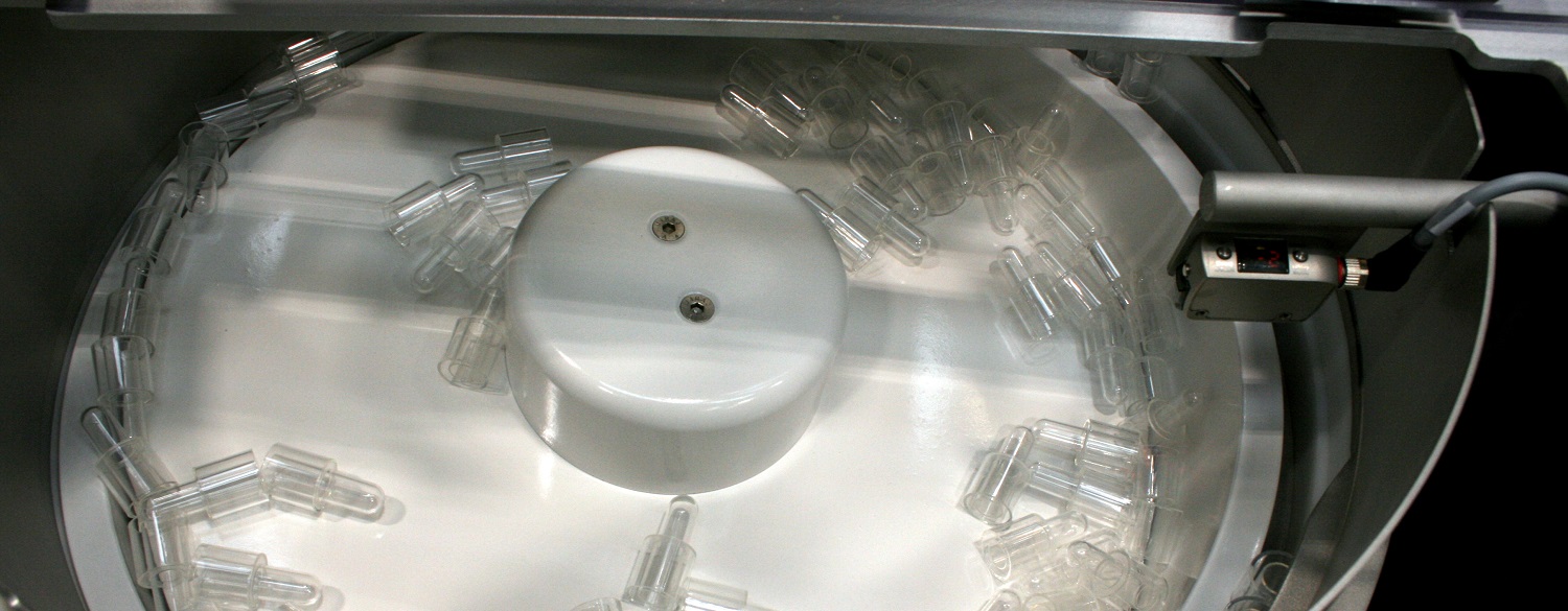 Centrifugal Feeder feeds and orientates Test Unit Body