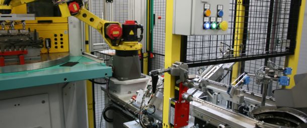 Robotic loading, testing and packaging system for tyre pressure sensors.