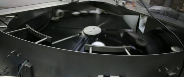 A centrifugal feeder handles muesli lids.