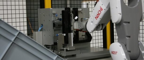 Robotics and automation systems de-moulding & assembly system handles & assembles plastic moulded letter box facia plates