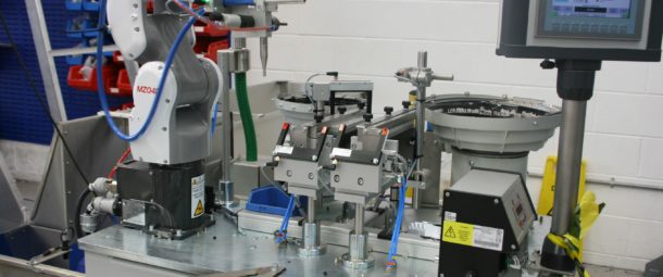 Robotic assembly system for screw shear and bung.