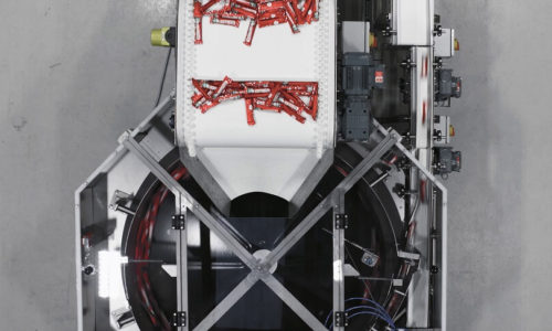 The VariFeed feeding system is handling wrapped confectionary bars - Food Packaging