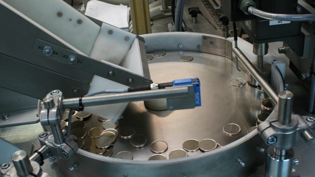 Centrifugal Feeder orientates and feeds a range of Coin Blanks