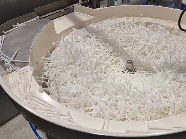 Bowl Feeder to feed, count, and dose Transfer Loops