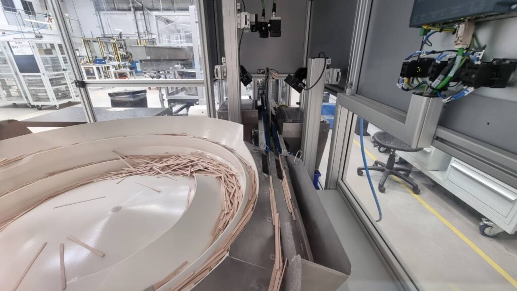 Bowl Feeder to feed, count, and dose Stir Sticks