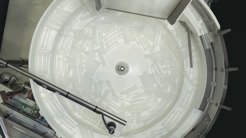 Vibratory Bowl Feeder feeds Vials vibratory bowl