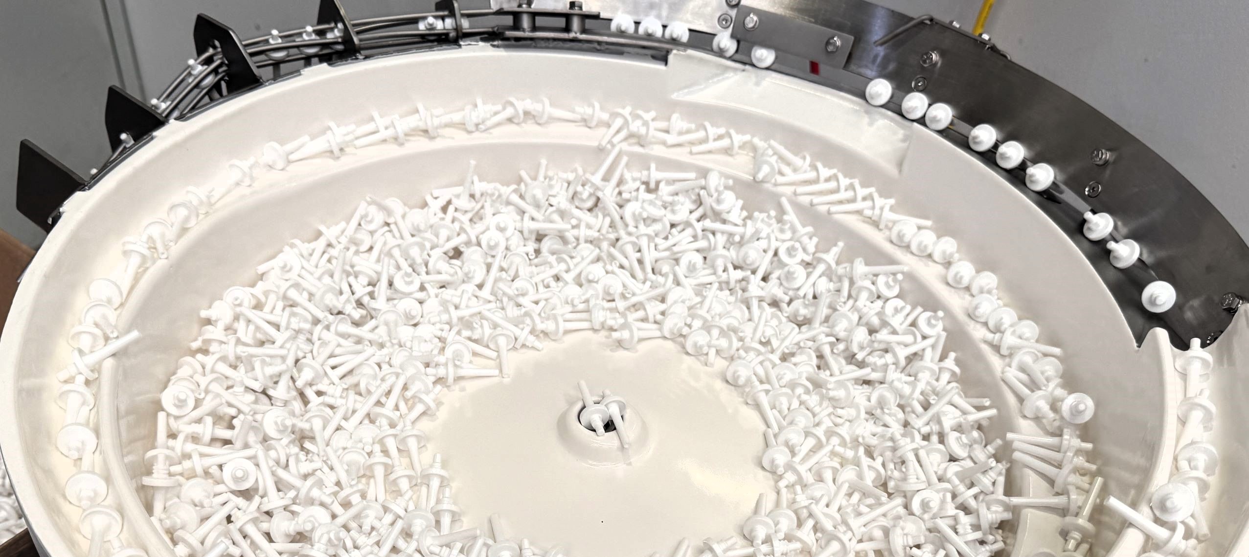 EcoType™ Bowl Feeder to Feed and Orientate Handles