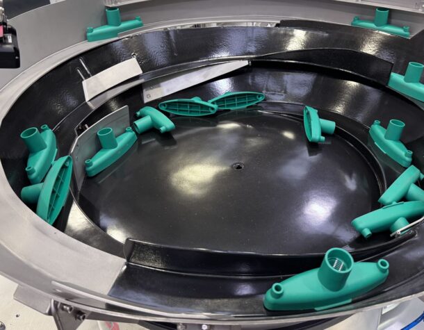 Bowl Feeders to feed and handle Mop Sockets and Clips
